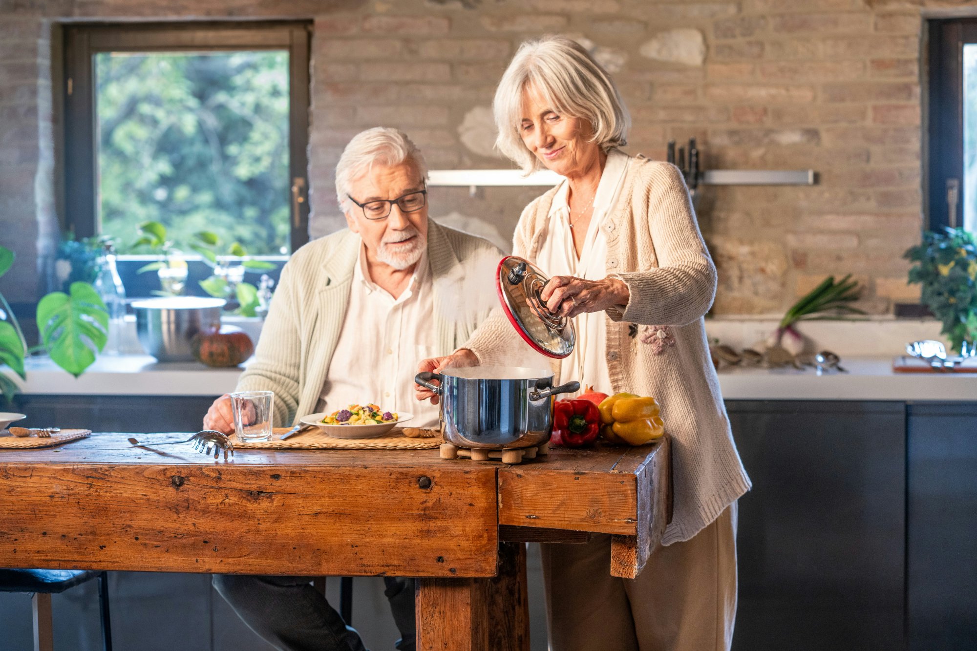 Elderly couple cooking together