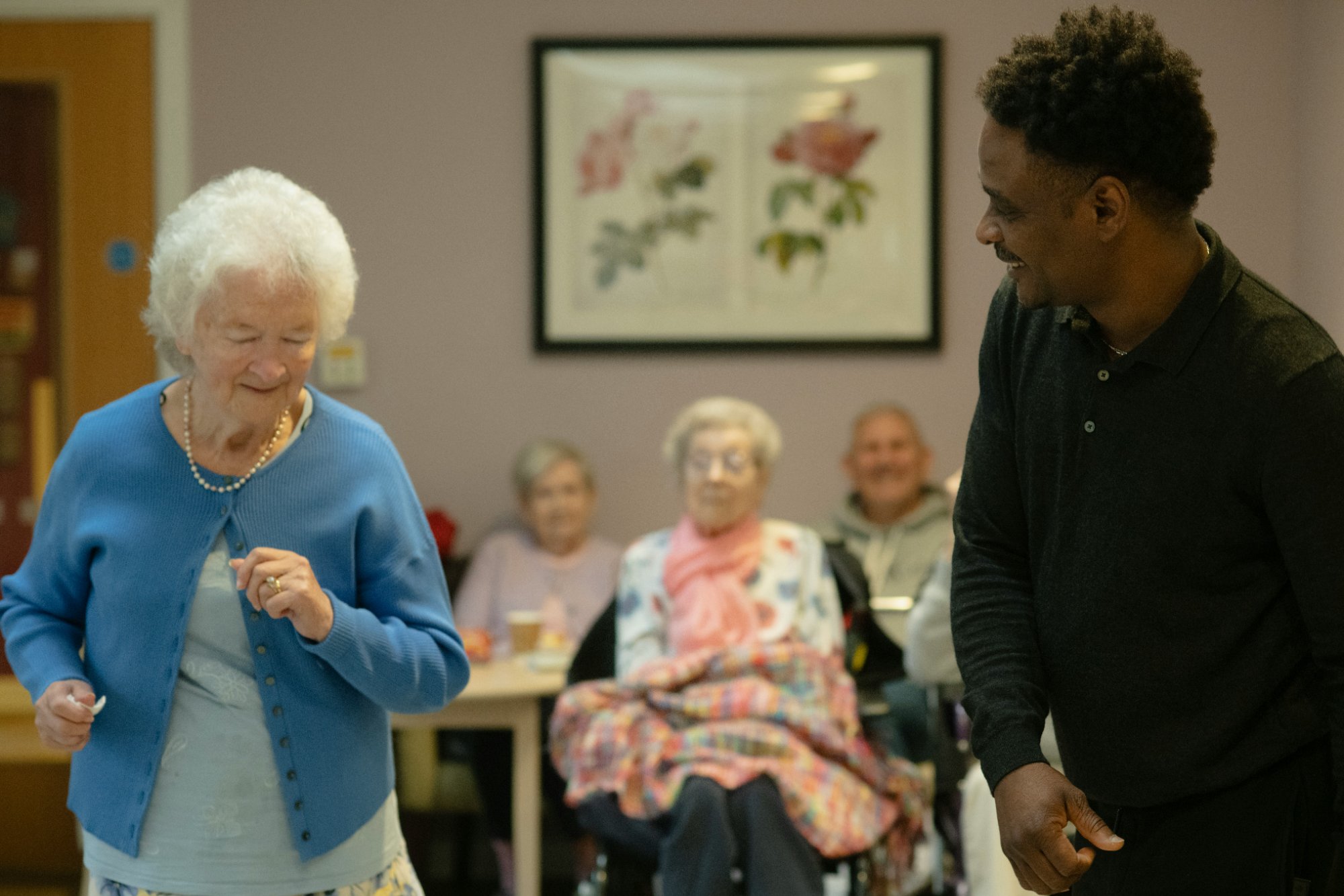 Carer dancing with elderly lady